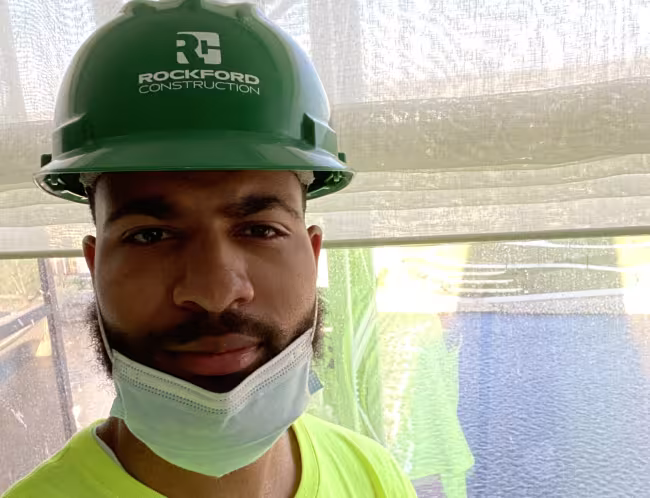 Shammer Martin in his hard hat at a job site.