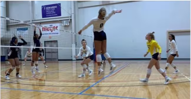 Volleyball team in action at Owens Express Invitational.