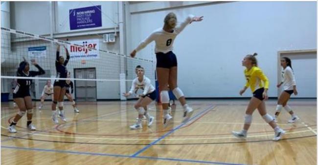 Volleyball team in action at Owens Express Invitational.
