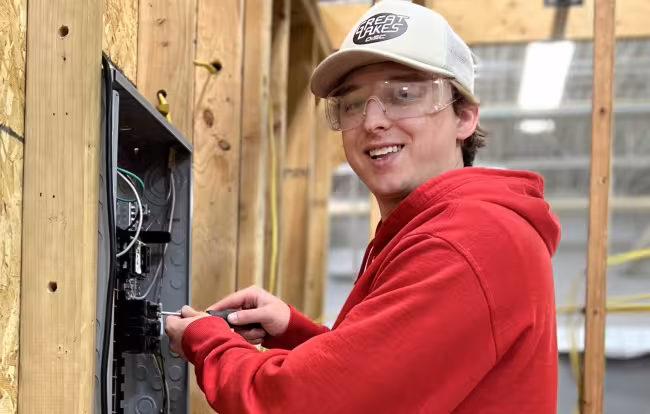 Ben Mast working on an electrical box.