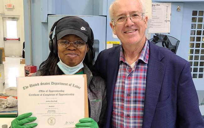 Jerrittia Roseburgh being presented with her certificate.