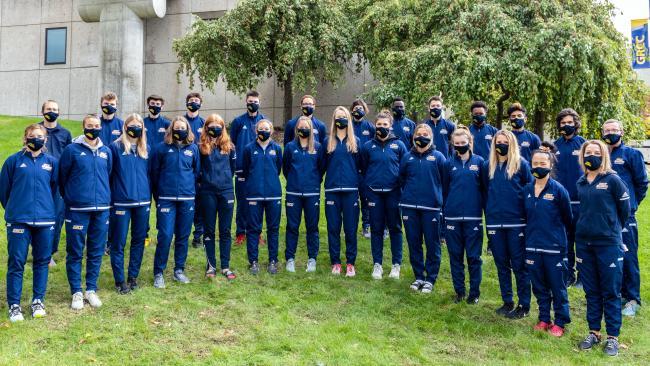 GRCC cross country teams posting for team photo, wearing face coverings for safety