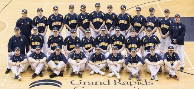 The members of the 2017-18 baseball team are in three rows -- sitting, kneeling and standing -- in the fieldhouse gym.