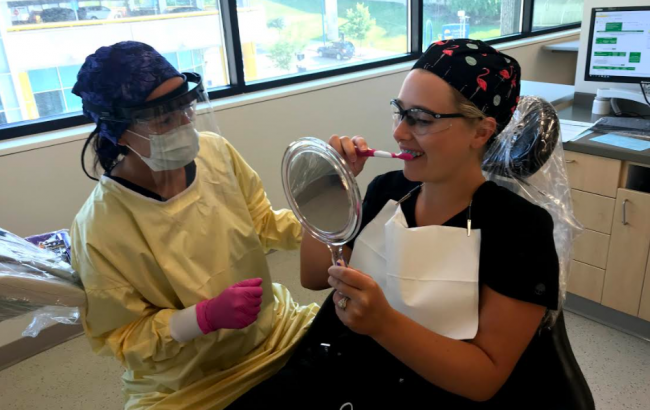 GRCC dental students practice brushing instruction.