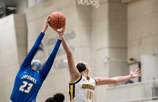 Danielle Lamancusa reaches to grab a rebound.