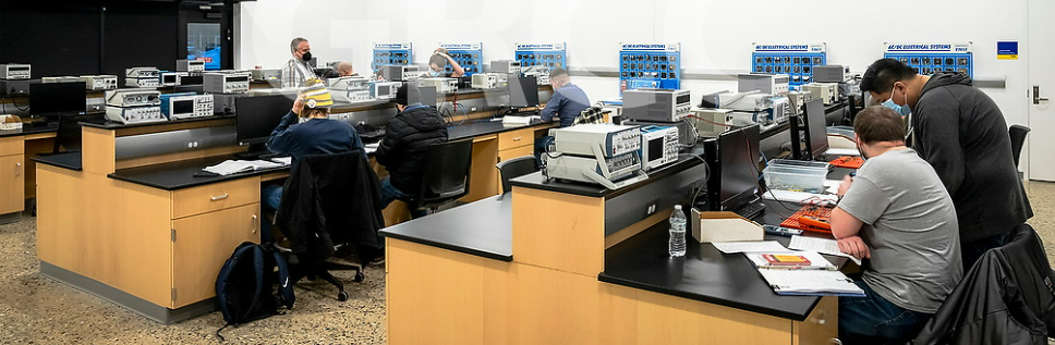 Students using tech ops equipment in a lab