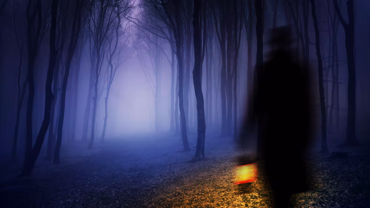 A piece by Andrew Caldwell featuring a shadowy person holding a lantern and walking into a misty forest.