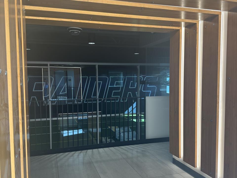 A hallway lined with repurposed bleachers.