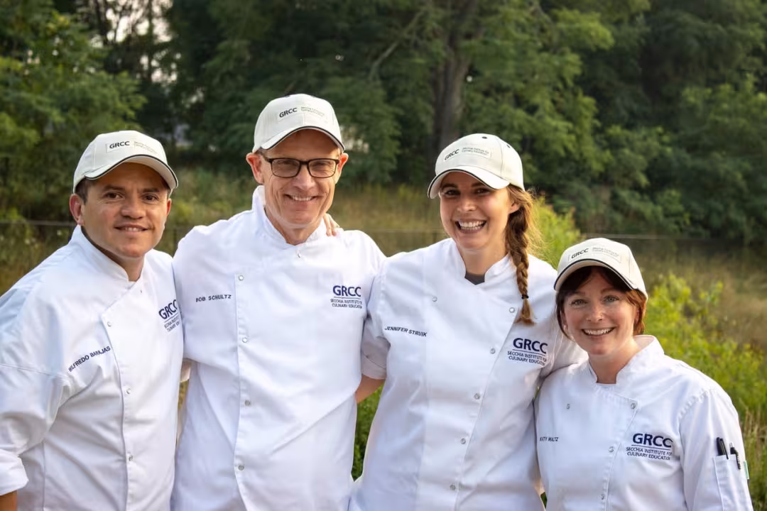 For people in GRCC culinary attire pose together.