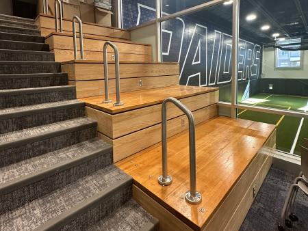 A staircase built partially with repurposed wood from bleachers
