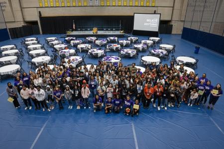 Conference participants pose for a group photo in the Ford Feildhouse.