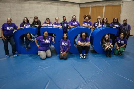 G3 conference mentors pose with big block letters that spell GRCC.