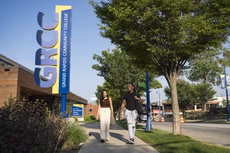 Two students walk past the GRCC Early Childhood Learning Laboratory.