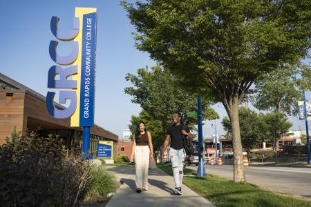 Two students walk past the GRCC Early Childhood Learning Laboratory.
