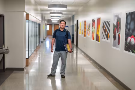 Student in the hallway in RJF 4th floor
