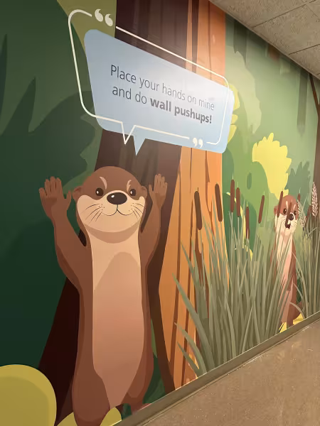 The completed sensory walk features an otter standing up for people to do wall push ups.