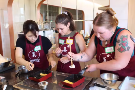 Students take a cooking class in Japan on a Study Away trip.