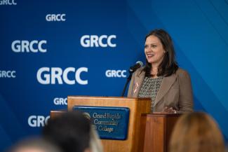 Rep. Glanville speaks at a podium.