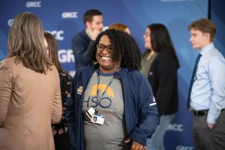 People talking to each other at the event.