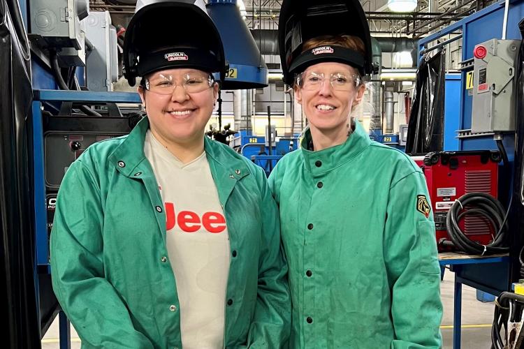 Tanya Contreras and Cheyenne Belonga photographed with welding hoods on their heads