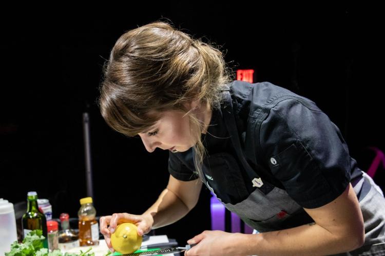 GRCC's Chef Jenn Struik prepares food for a meal