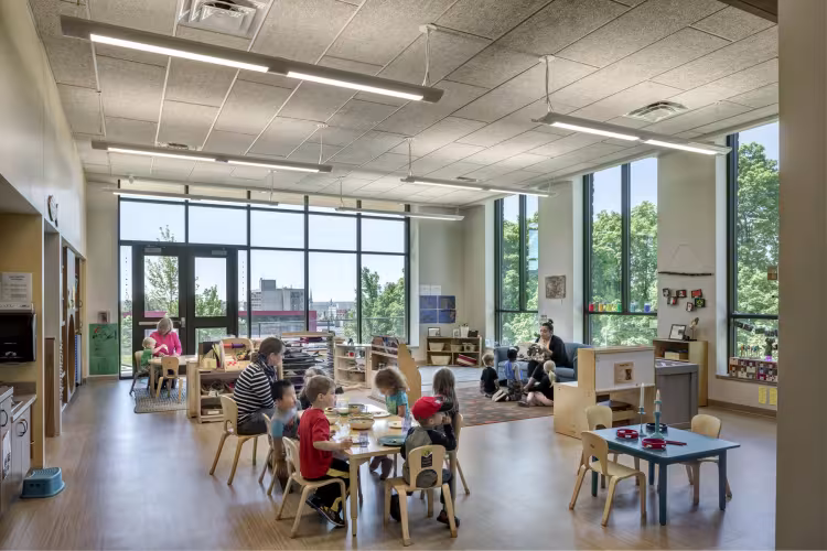 Faculty and students work with groups of children in GRCC's Early Childhood Learning Laboratory.