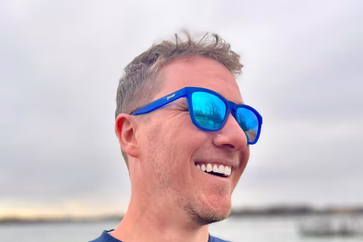 GRCC Student John Miedema pictured outside near a body of water.