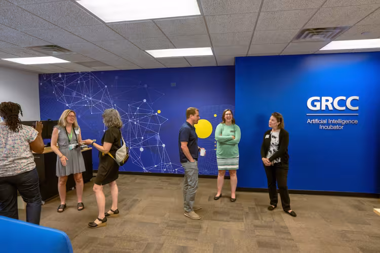 Community members explore GRCC's AI Incubator center.