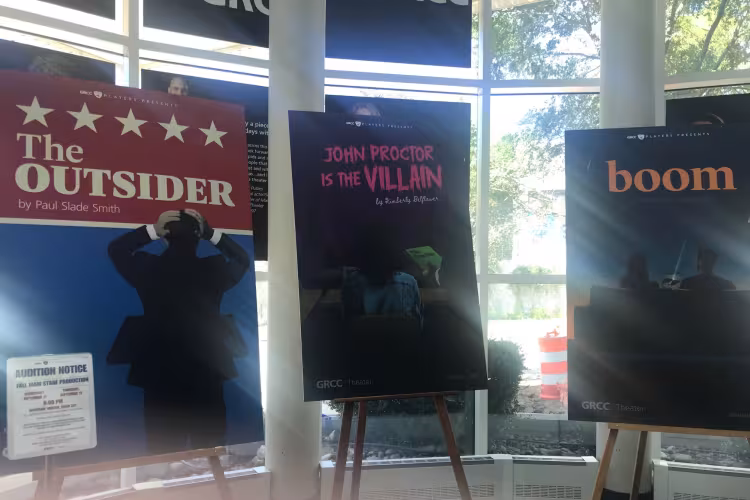 Three theater posters displayed in GRCC's Spectrum Theater to announce this season's productions.