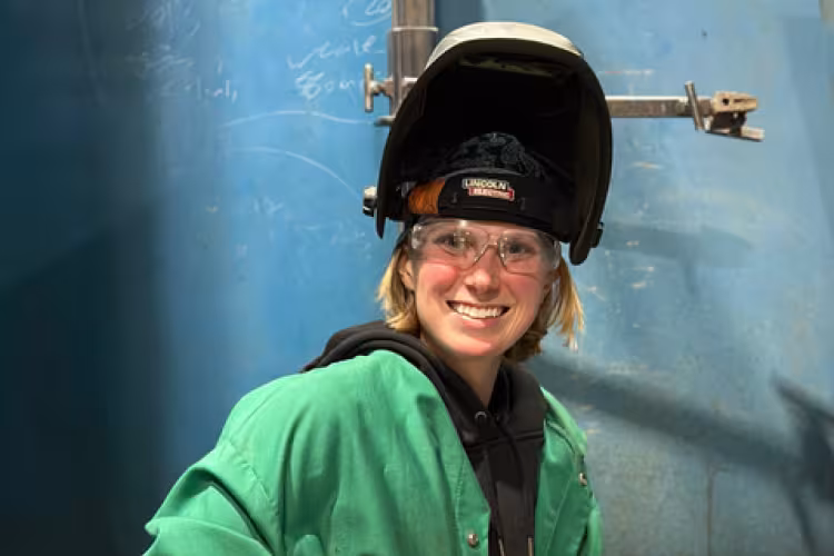 GRCC welding instructor Brianna Lampe-Sedgwick poses in her welding gear.