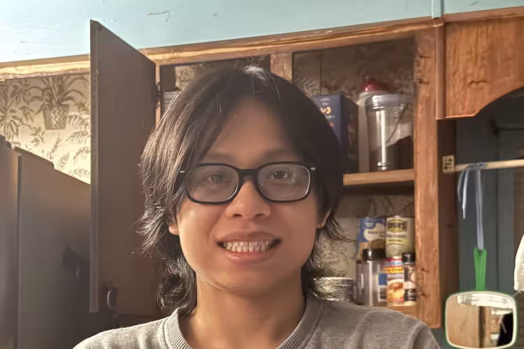 GRCC student Phillip Huynh poses for a photo at home.