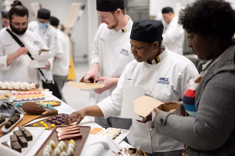 Students in GRCC's Culinary Arts program prepare pastries for sale.