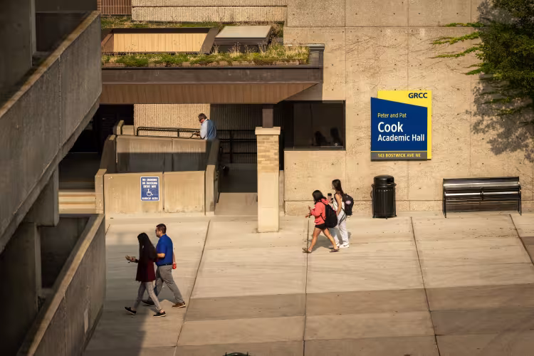 Students walk past Cook Academic Hall