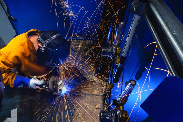 A person welding.