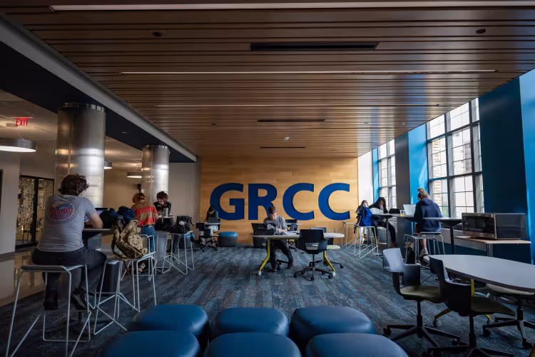 Students sit in a common area and study.