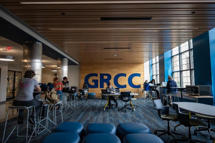 Students sit in a common area and study.