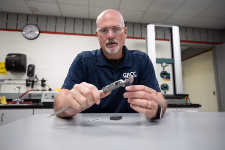 A Quality Science instructor uses precision measuring tools in the classroom..