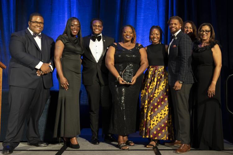 The family of 2002 GIANT Among Giants winner Bishop Dennis McMurray  accepting his award.