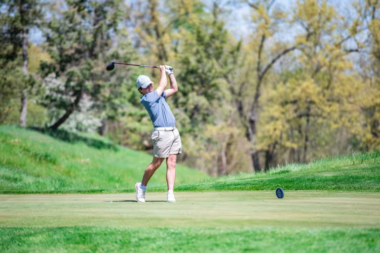 GRCC golfer following through on a drive from the tee. 