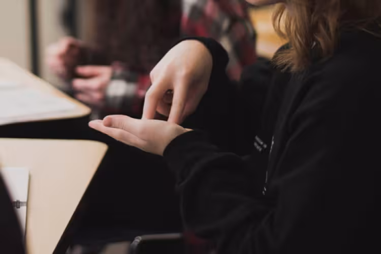 A person signing with their hands. 