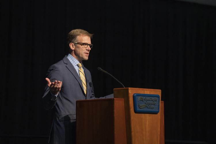Provost Knetl speaking at a podium. 