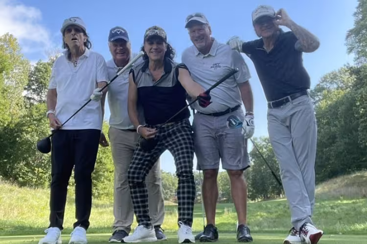 Rocker Alice Cooper with GRCC golf coach John Forton, guitarist Ryan Roxie, coach Mark Rasmussen, and bass player Chuck Garric