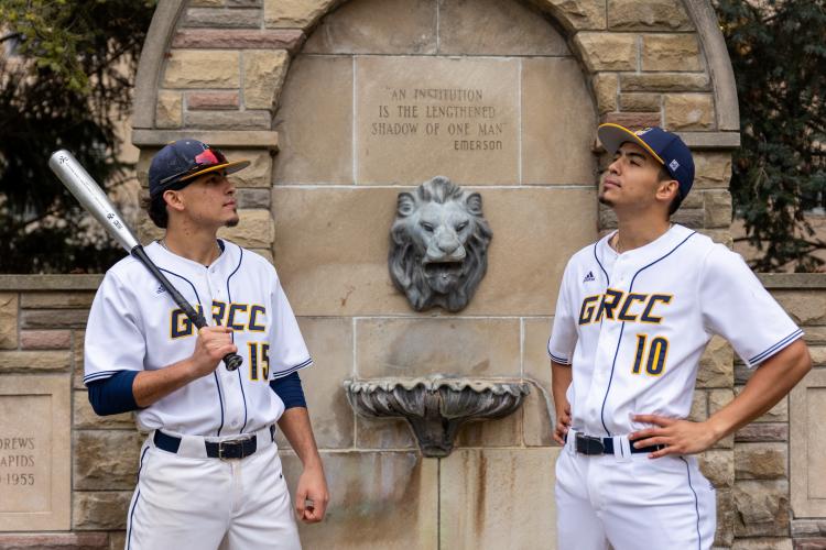 Andres and Fernando Rivera-Calderon posing with GRCC's iconic lion fountain. 