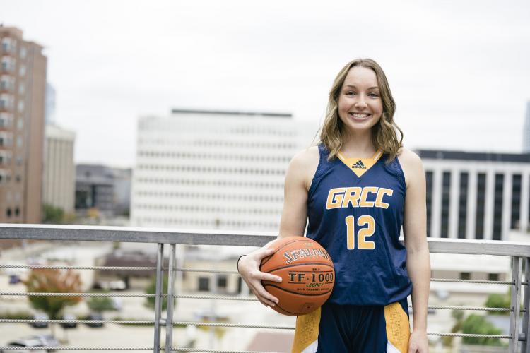 Marlene Bussler posing with a basketball.