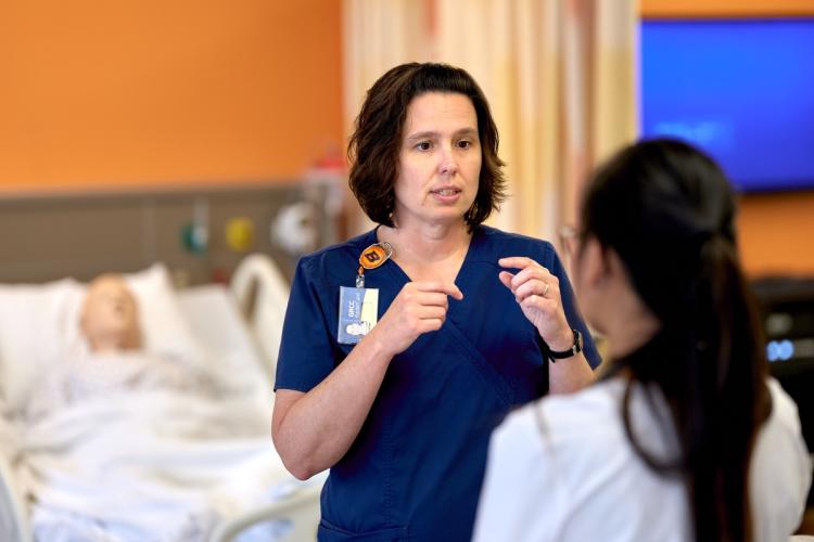 Professor Brandi Miller working with students.