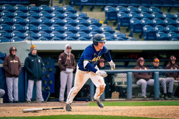 GRCC baseball player leaving the box after hitting the ball.