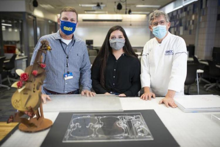 Professor Mike Merchant, Launch U student Marciana Gutierrez and Chef Gilles Renusson