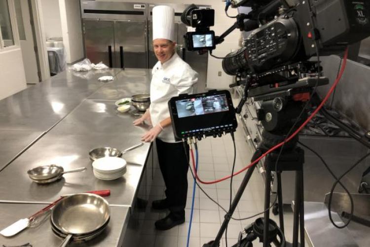 Chef Bob Schultz recording a video of a lesson making sauces.