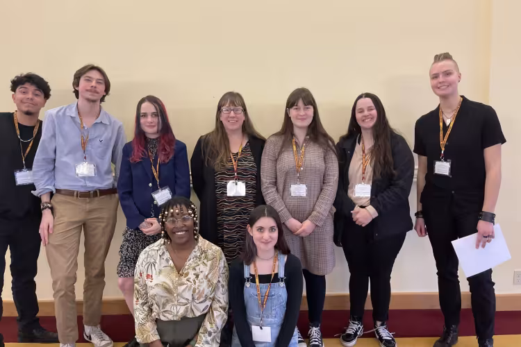 Collegiate students posing at the event.