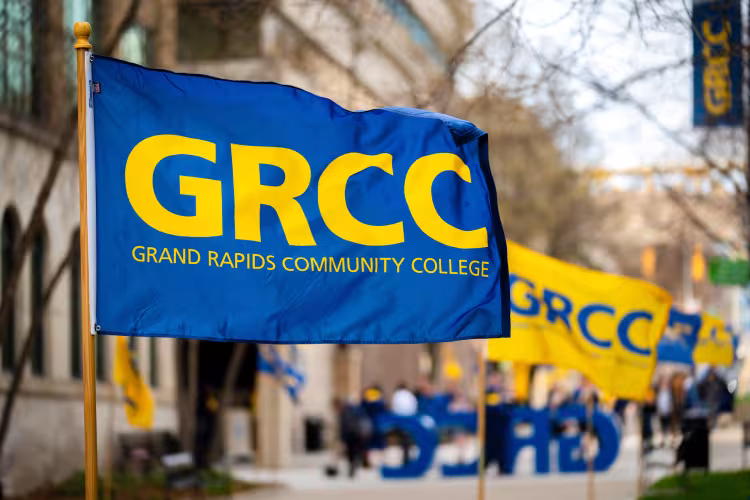 GRCC flag decorations in the breeze on Olivarez Plaza.
